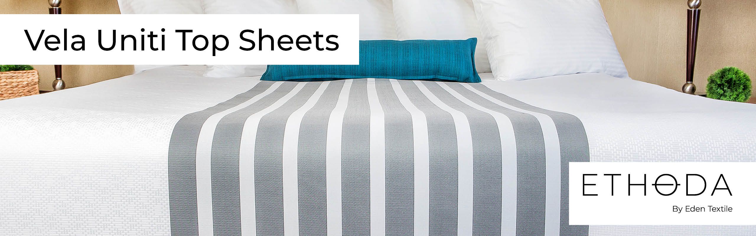 Bed with Vela Uniti Top Sheet Vertical Regency Stripe Pattern