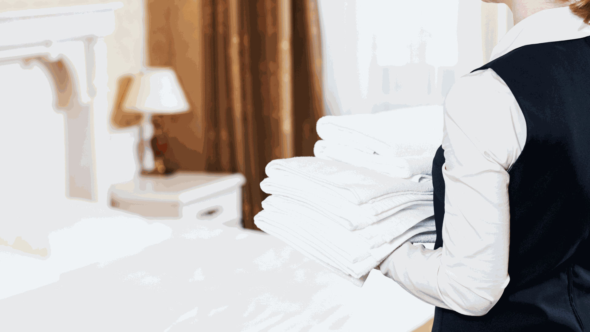 Housekeeping Bringing New Linens to Hotel Room